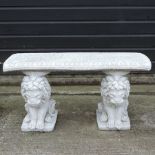 A reconstituted stone garden bench, on lion supports,