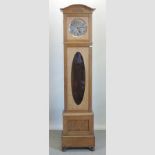 An early 20th century light oak longcase clock,