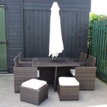 A rattan garden cube table, 125 x 125cm, together with four matching chairs,