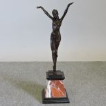 An Art Deco style bronzed figure of a dancer, on a marble base,