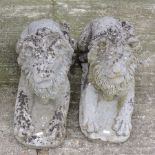 A pair of reconstituted stone models of lions,