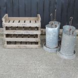 A collection of four galvanised chicken feeders, together with four wooden chitting trays,