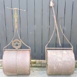 A garden roller, together with another,