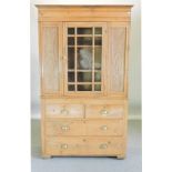 An early 20th century satin walnut glazed cabinet, with drawers beneath,