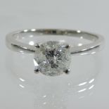 An 18 carat white gold solitaire diamond ring, 1.