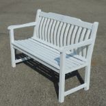 A white painted wooden garden bench,
