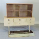 A 1970's dressing table, together with a teak bookcase,