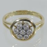 A 14 carat gold diamond cluster ring,