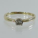 A 9 carat gold solitaire diamond ring,