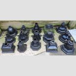 A collection of fifteen black painted iron hoppers