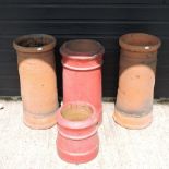 A pair of terracotta chimney pots, 62cm,