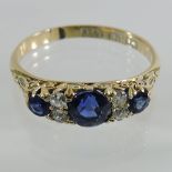 An 18 carat gold, sapphire and diamond ring,