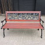 A green painted metal and slatted garden bench,