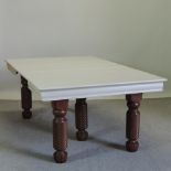 A late 19th century French carved oak and later painted pull-out dining table,