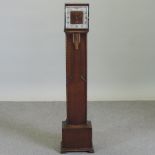 A 1930's oak cased granddaughter clock,