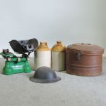 A World War I helmet, in a metal hat box, together with a set of cast iron scales and weights,