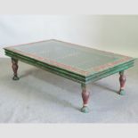 An Indian painted hardwood and wrought iron coffee table, with a glass top,