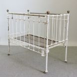 A Victorian white painted iron cot,