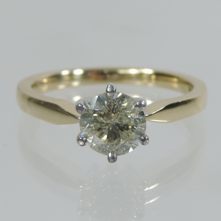 An 18 carat gold solitaire diamond ring, approximately one carat,