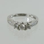 A 10 carat white gold and diamond ring