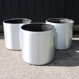 Three brushed aluminium garden planters,