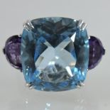 An 18 carat white gold amethyst and topaz dress ring,