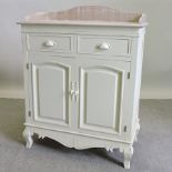 A cream painted wash stand,