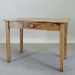 A pine side table, with a single drawer,