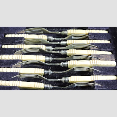 A set of ten Victorian silver and ivory pastry forks, Sheffield 1835,
