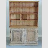 An antique and later pine dresser,