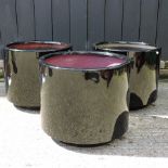 A set of three black garden planters,