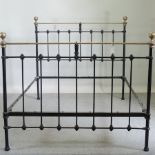 A Victorian brass and iron double bedstead,