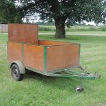 A wooden single axle car trailer,