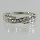 An 18 carat white gold eternity ring,