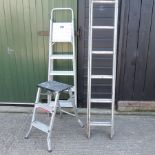 An extending aluminium ladder,