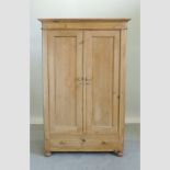 An antique pine armoire,