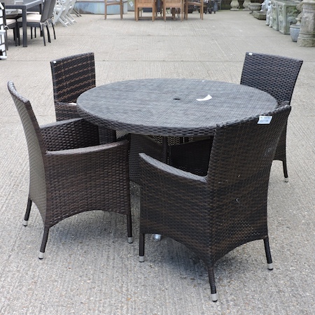 A rattan circular garden table, 120cm diameter,