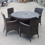 A rattan circular garden table, 120cm diameter,