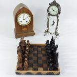 An Edwardian walnut and inlaid mantel clock, 29cm tall,