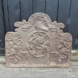 An 18th century cast iron fireback, with relief decoration,