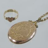 An 18 carat gold ring, set with a heart, together with an unmarked locket on chain,