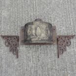 A 19th century cast iron rain hopper, together with a pair of iron brackets,