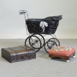 A dolls pram together with a mahogany and tapestry upholstered foot stool and wine case