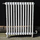 A Victorian white painted cast iron radiator, 63cm,