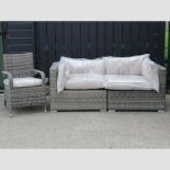 A rattan garden sofa in two sections, 177cm overall,