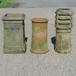 A Doulton chimney pot, together with two others,