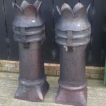 A pair of terracotta chimney pots,