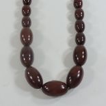 A cherry amber bakelite graduated bead necklace