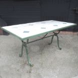 A pair of green painted iron and travertine tiled bespoke made garden tables,