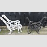 A pair of white painted aluminium bench ends,